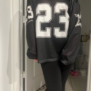Black and White Sports Jersey with Number 23